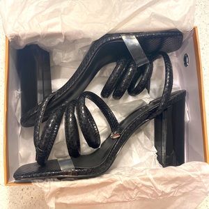 Size 10, 3 Inch heels. Black snake print.